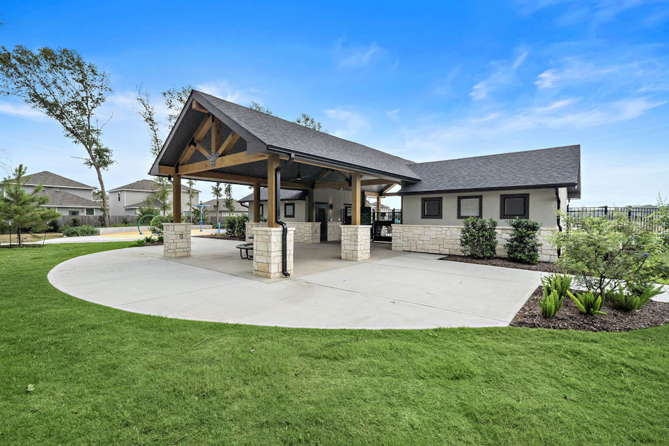 A house with a grass yard.
