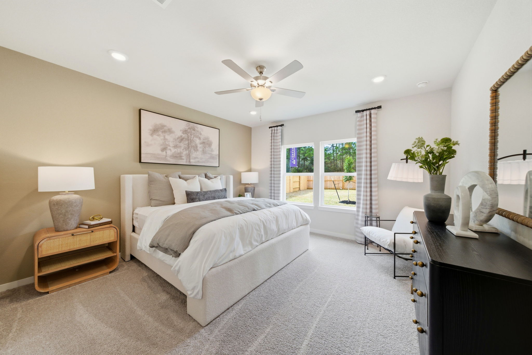 A bedroom with a large bed and a large window.