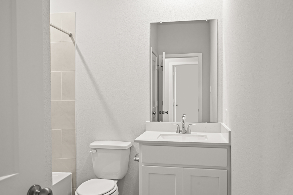 A bathroom with a sink and toilet.