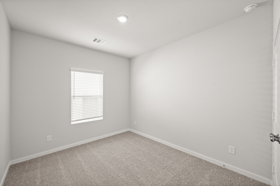 A room with a door and a window.