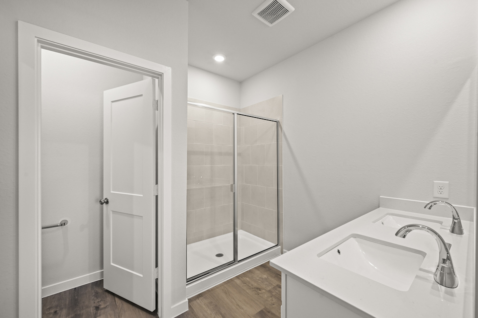 A bathroom with a glass shower.