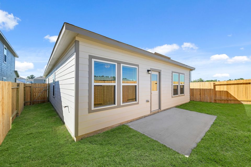 A small house with a fence.