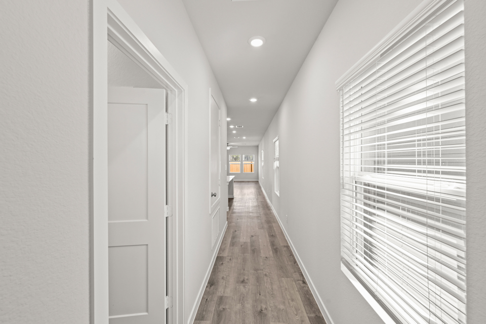 A hallway with white walls.