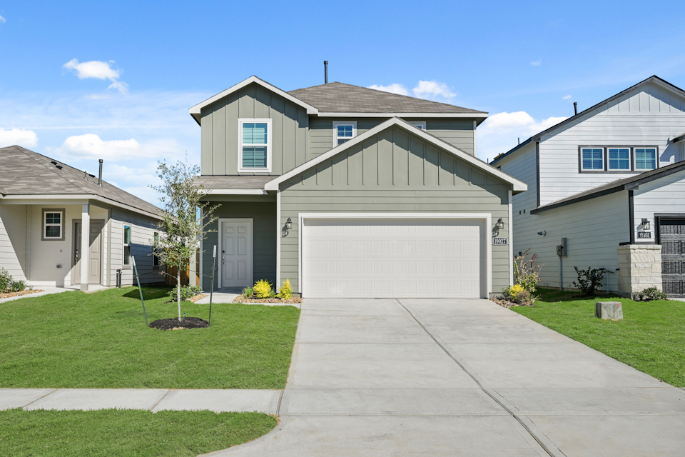 A driveway leading to a house.