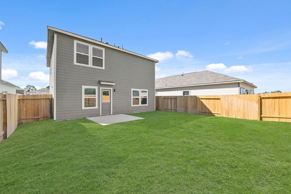 A house with a fence around it.
