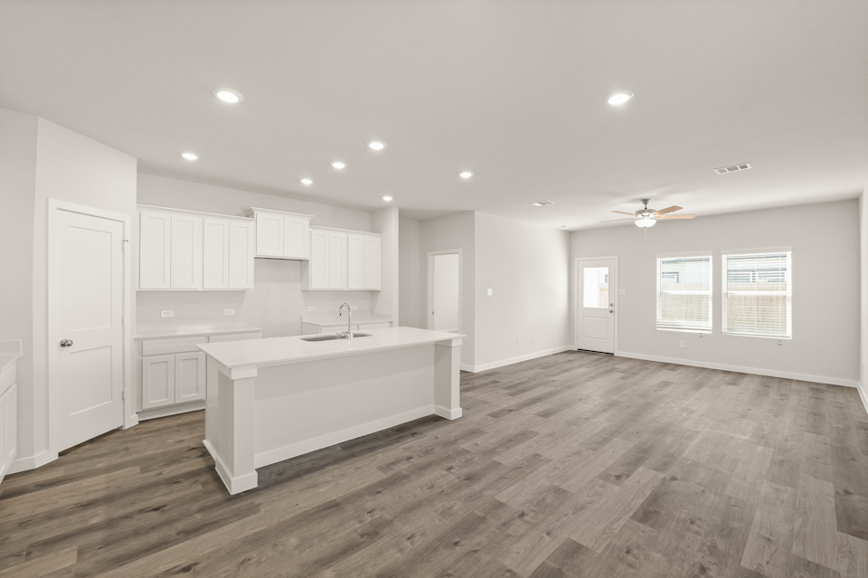 A large kitchen with white cabinets.