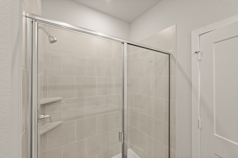 A shower unit in a bathroom.