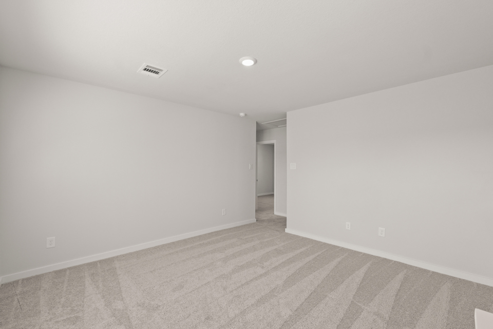 A hallway with white walls.