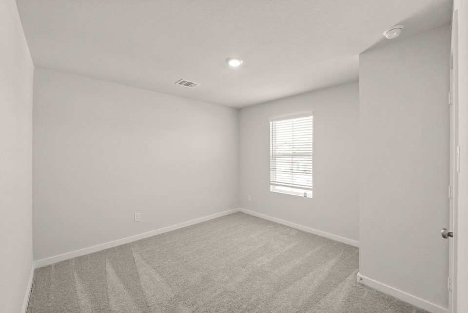 A room with a door and a window.