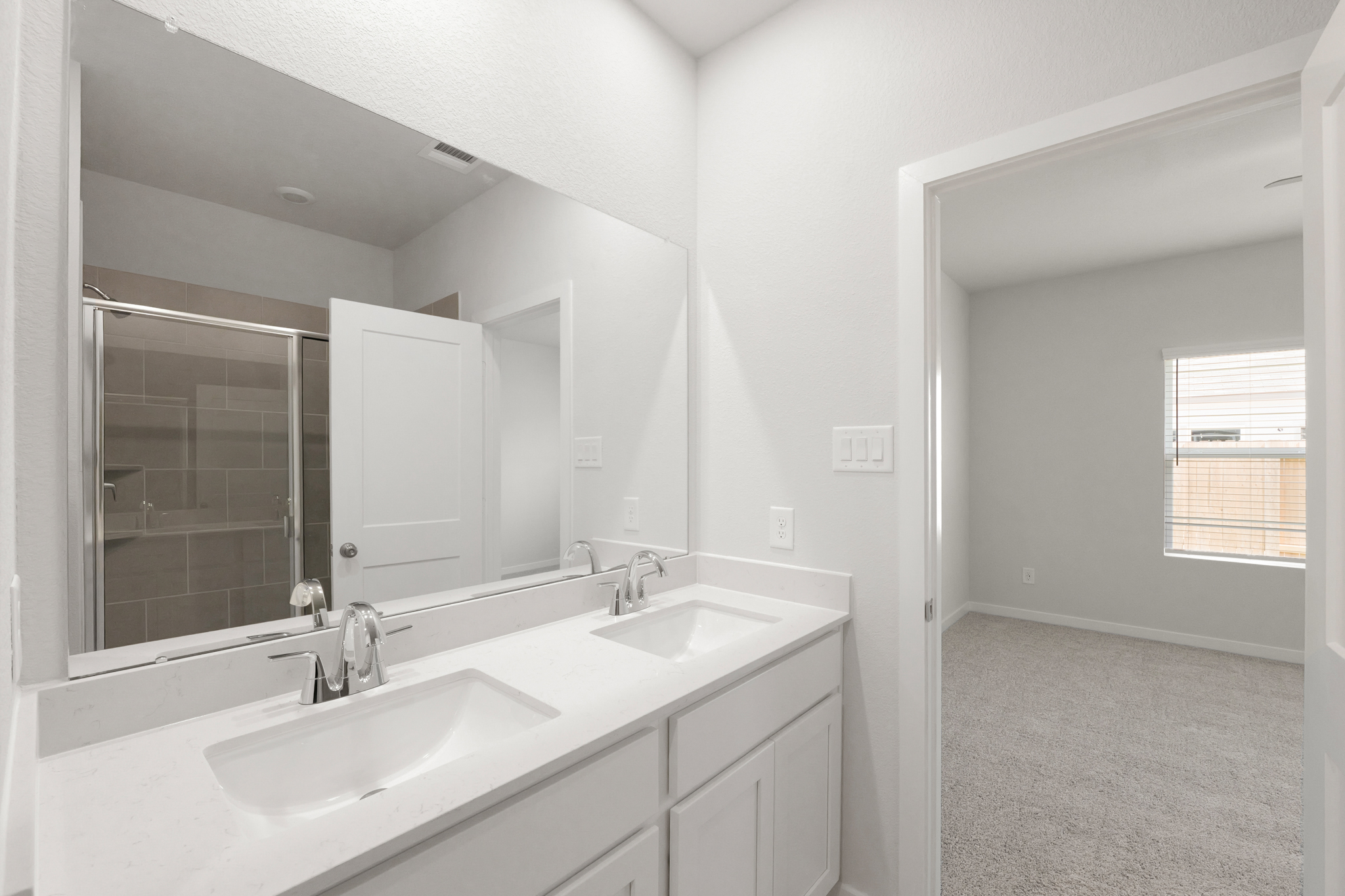 A bathroom with two sinks.