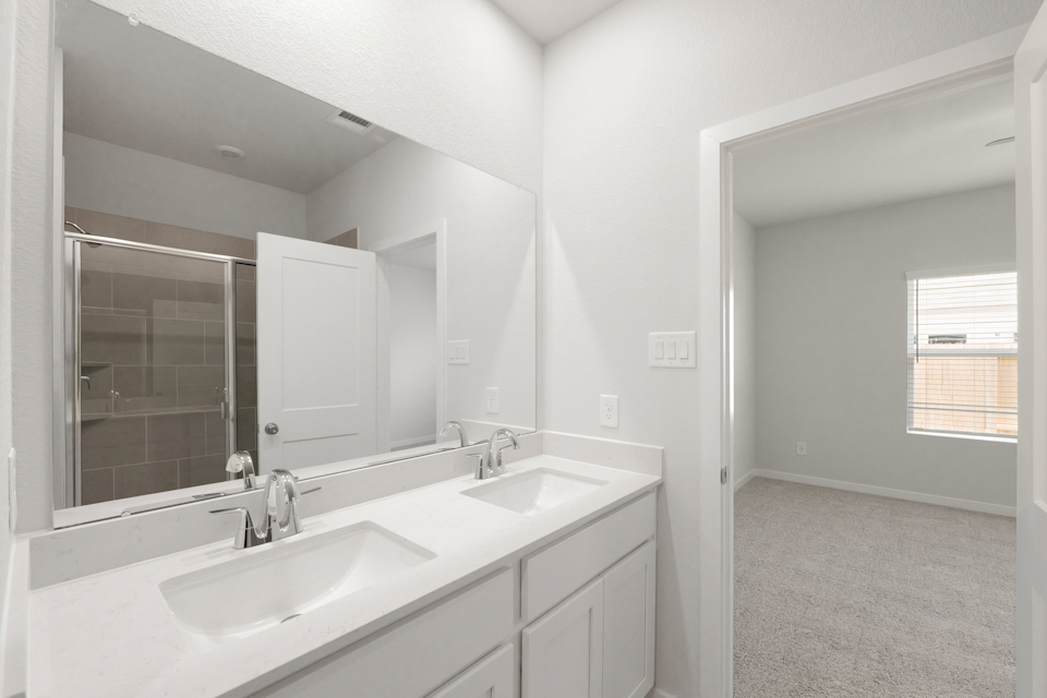 A bathroom with two sinks.