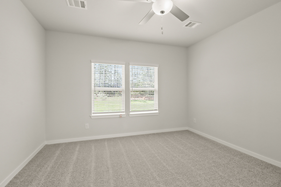 A room with a light on the ceiling.