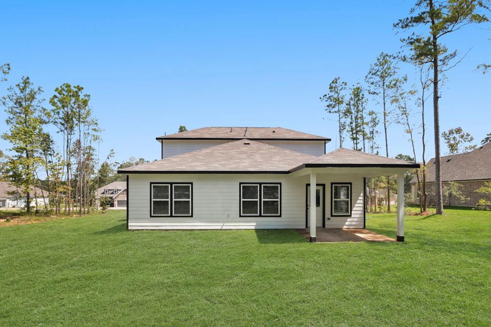 A house with a grass yard.