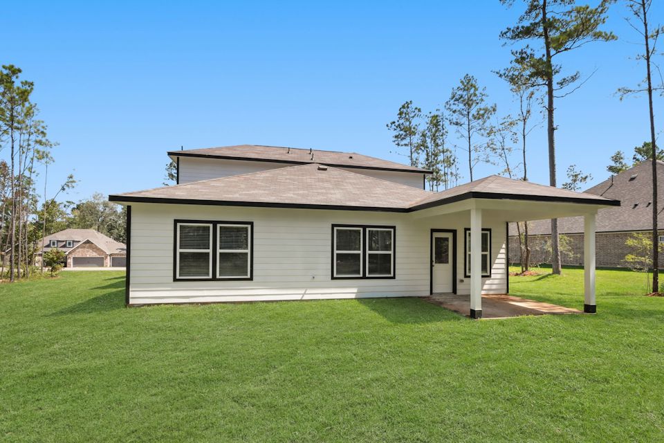 A house with a grass yard.