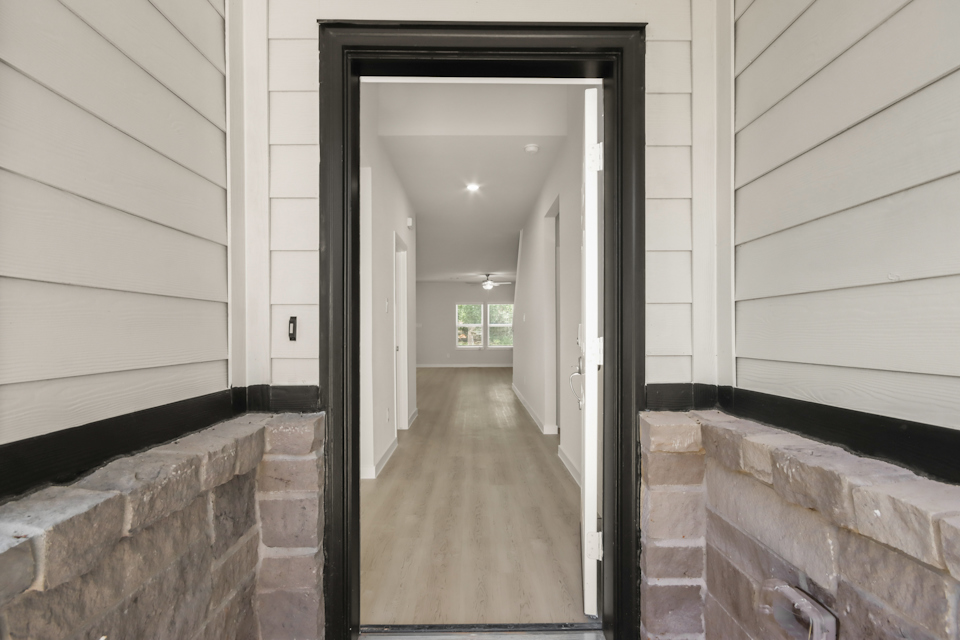 A hallway with brick walls.