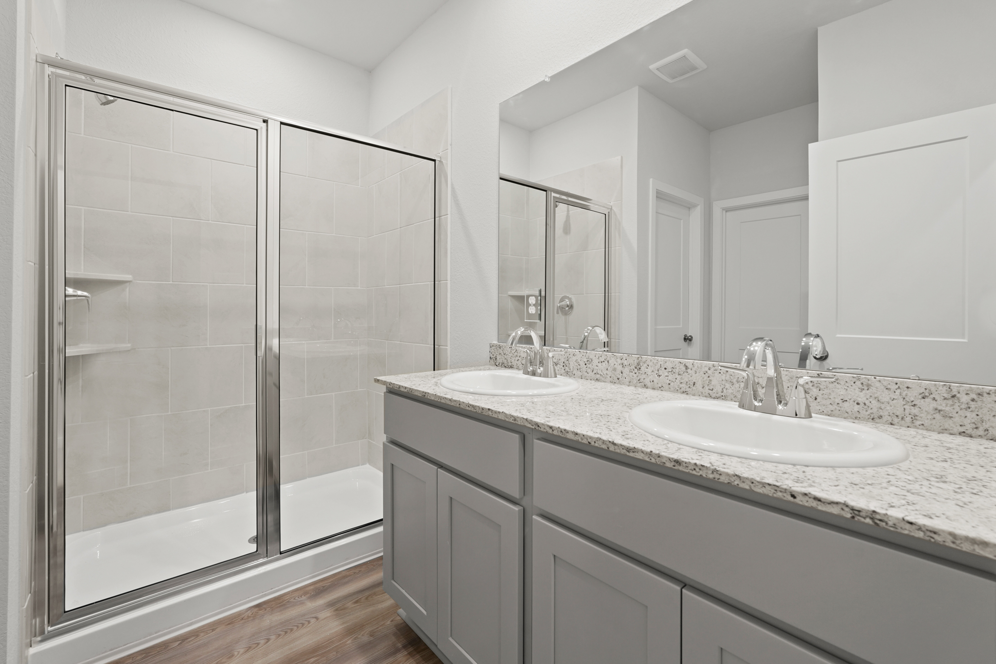 A bathroom with a glass shower.