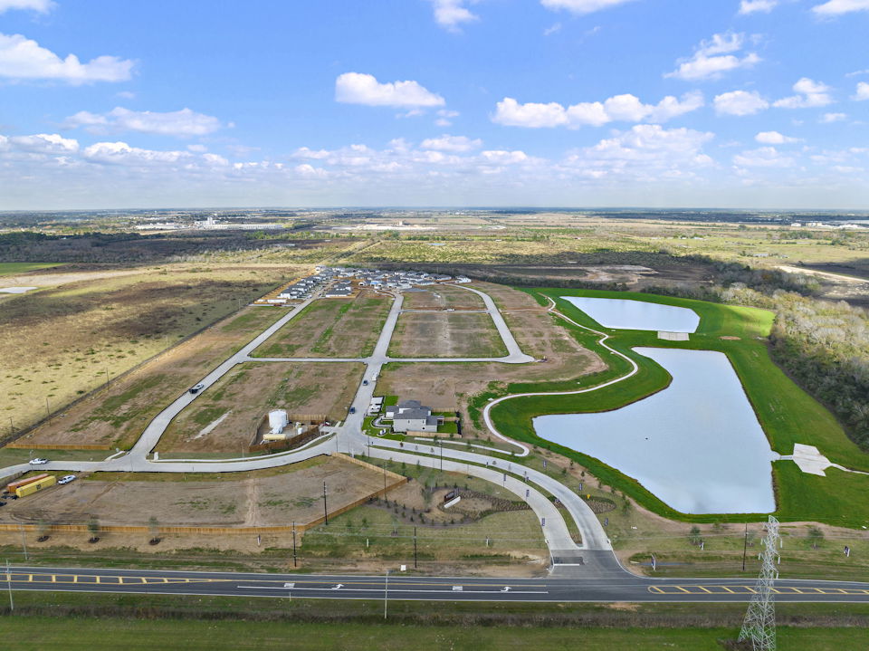 A large area with roads and a body of water in it with Prairie Queen Recreation Area in the background.