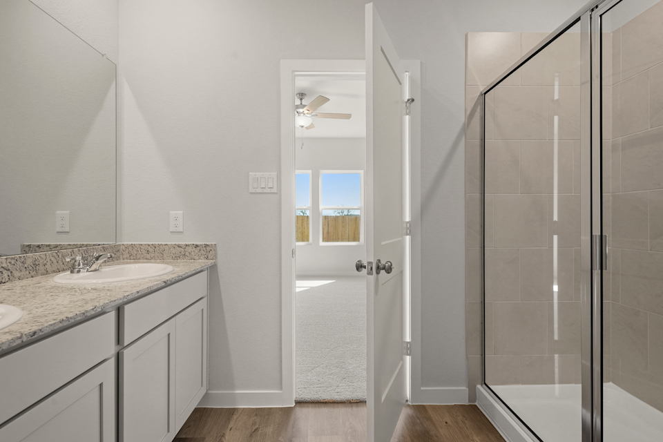 A bathroom with a glass shower.