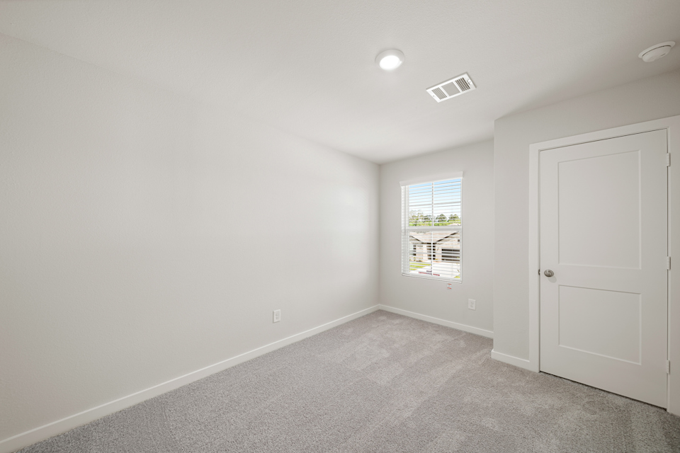 A room with a door and a window.