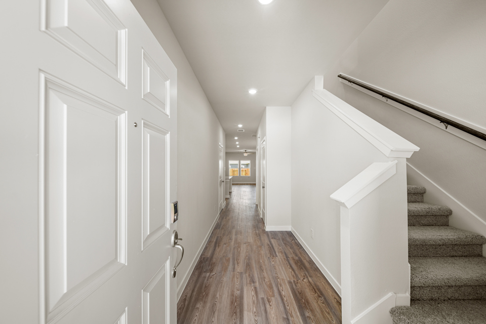 A hallway with white doors.