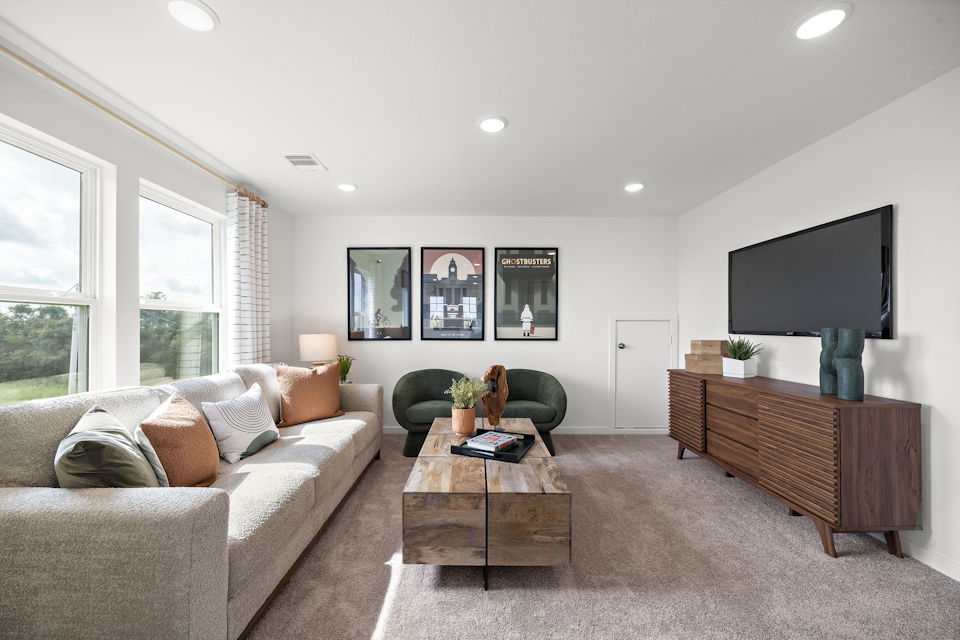 A living room with a tv and couches.