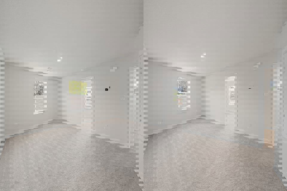 A room with a carpet and a rug.