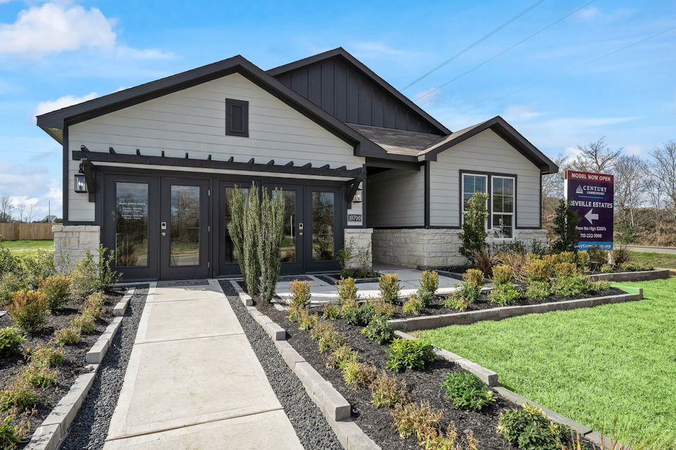 A house with a sign in front.