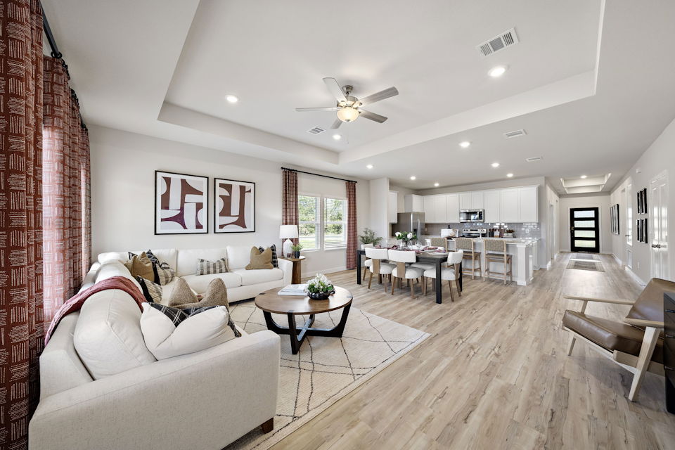 A living room with a wood floor.