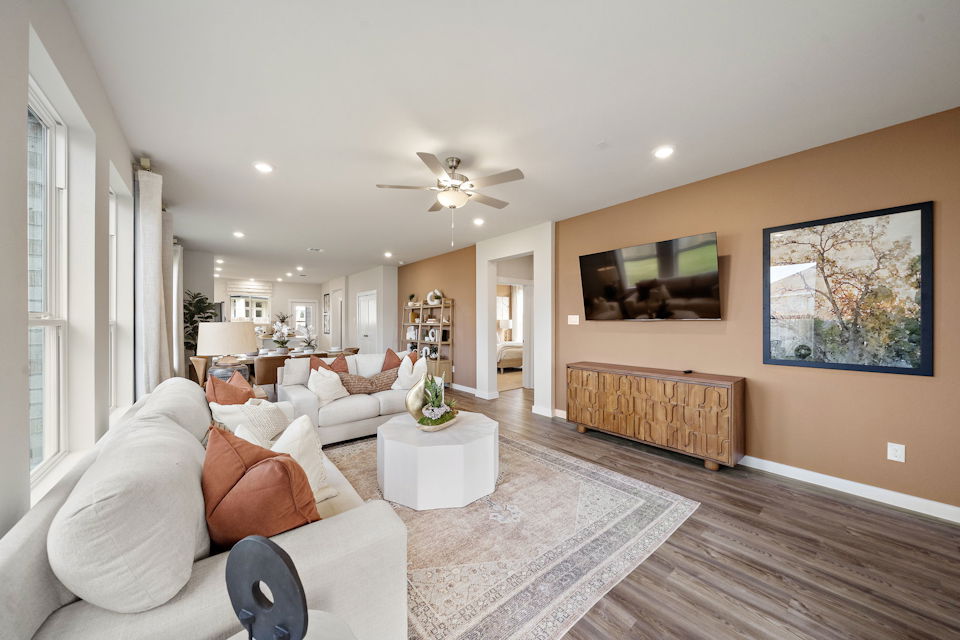 A living room with a couch and a table.