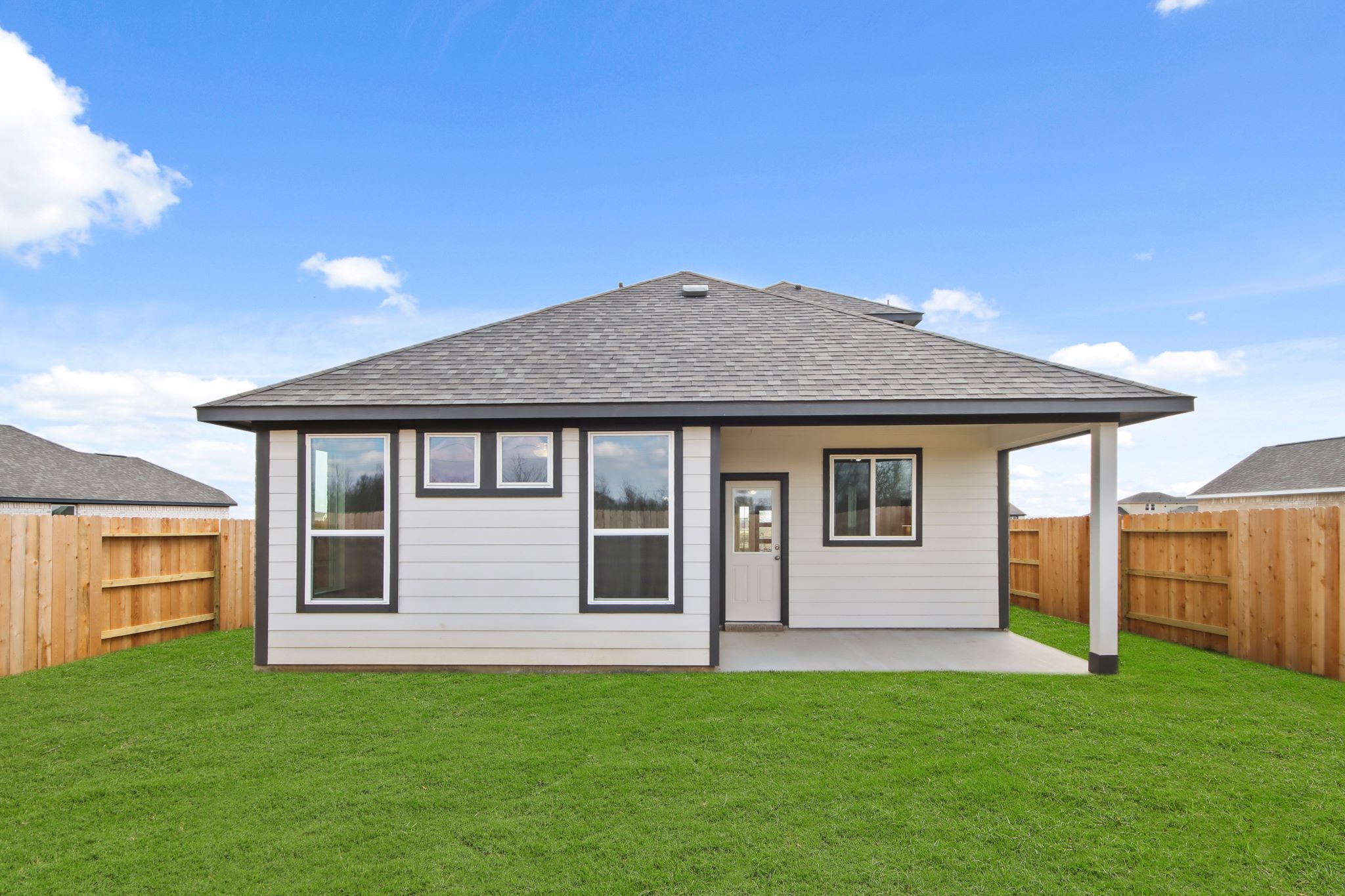 A house with a grass yard.