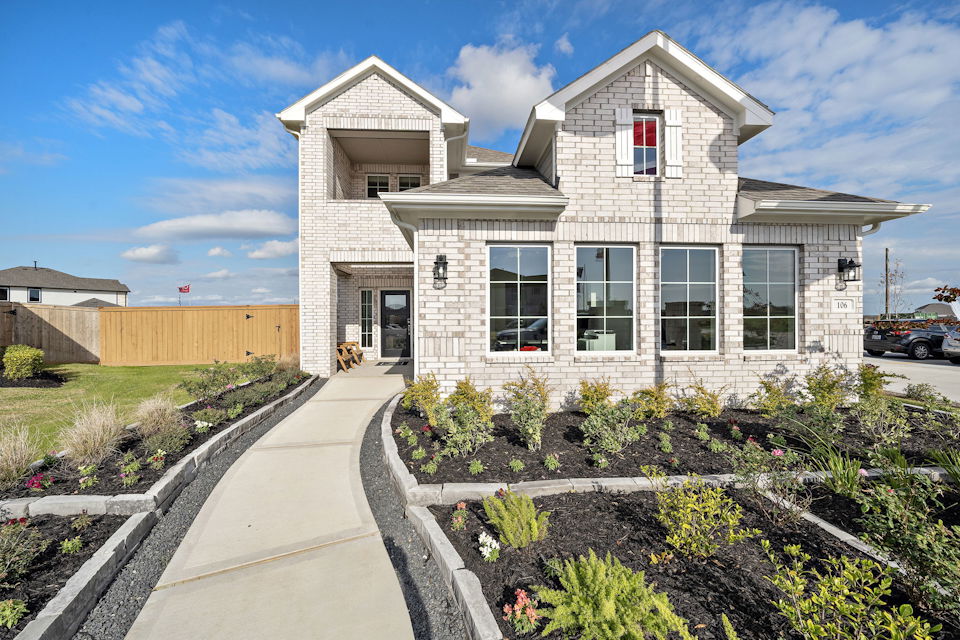 A white house with a driveway.