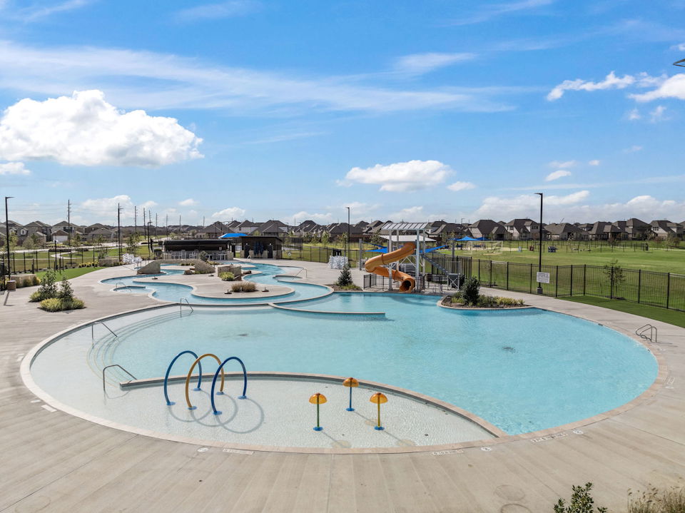 A swimming pool with a slide.