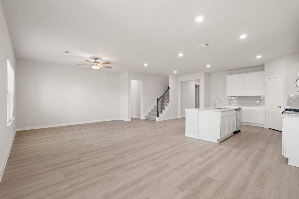 A large kitchen with white cabinets.