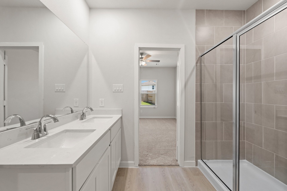 A bathroom with a glass shower.