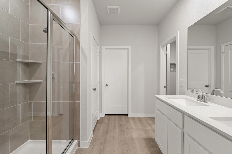 A bathroom with a glass shower.