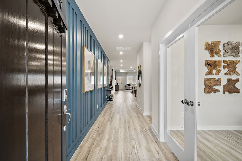 A hallway with blue doors.