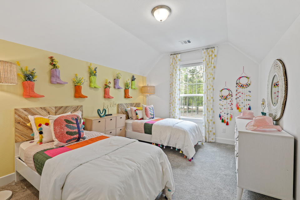 A bedroom with two beds.