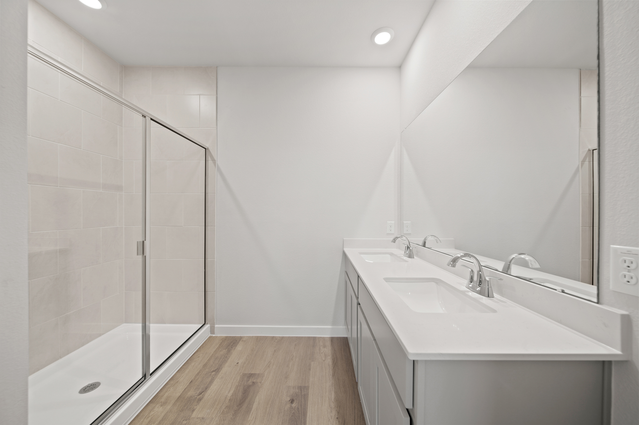 A bathroom with a glass shower.