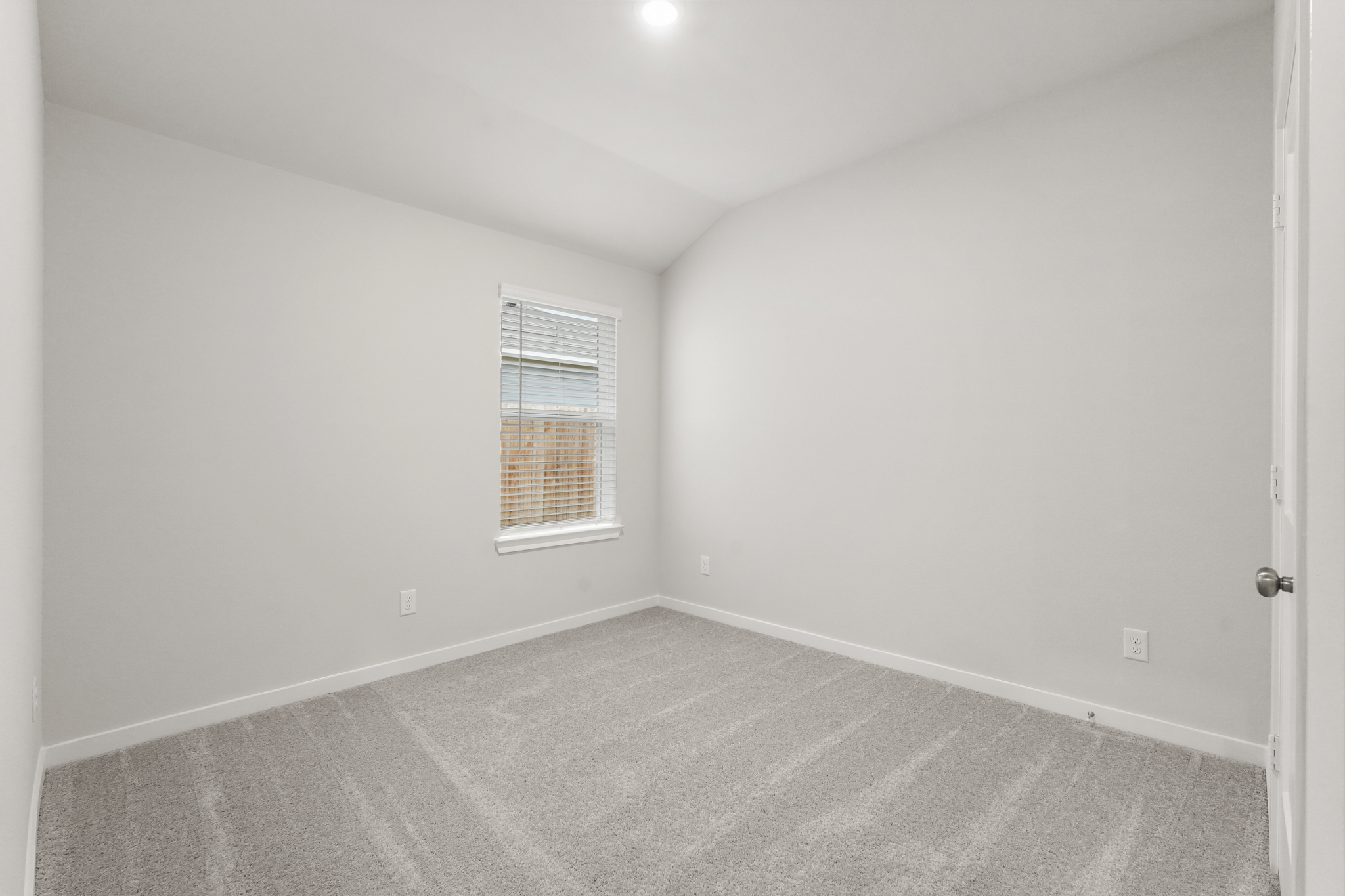 A room with a door and a window.