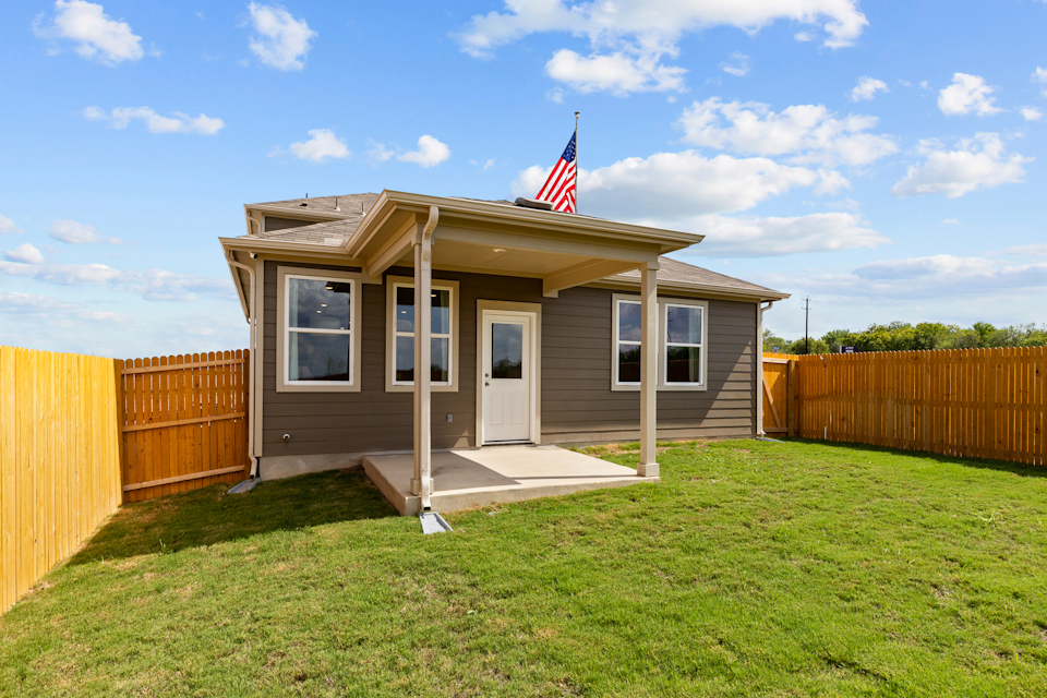 A small house with a flag on the roof.