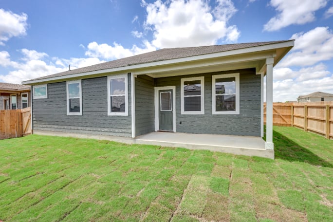 A house with a fence around it.