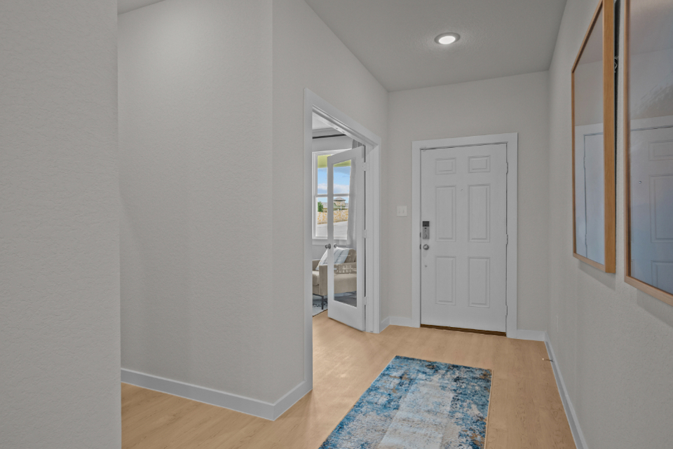 A hallway with white doors.