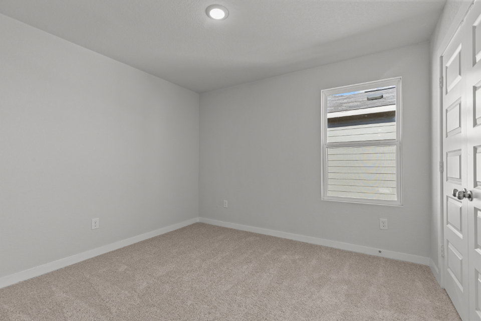 A room with a door and a window.