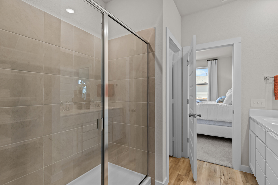 A bathroom with a glass shower.