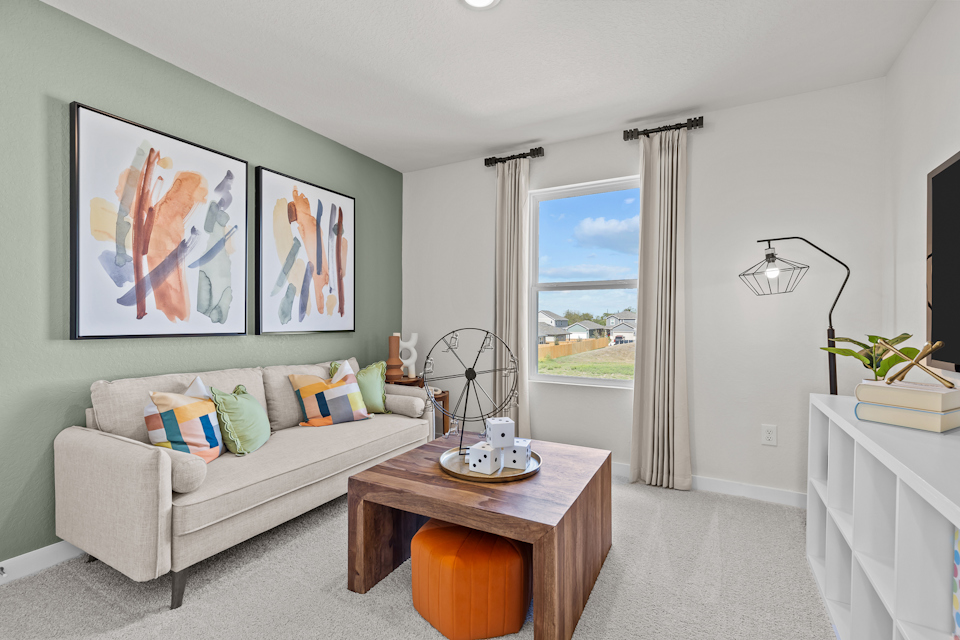 A living room with a couch and a table.
