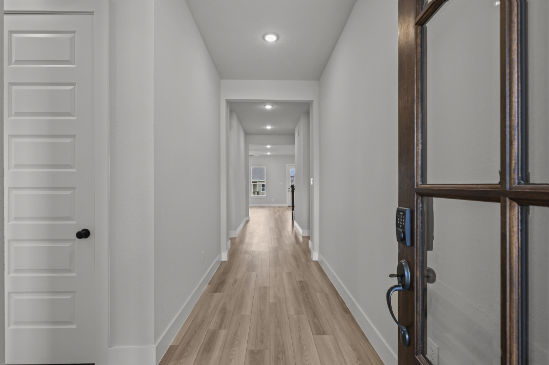 A hallway with white doors.