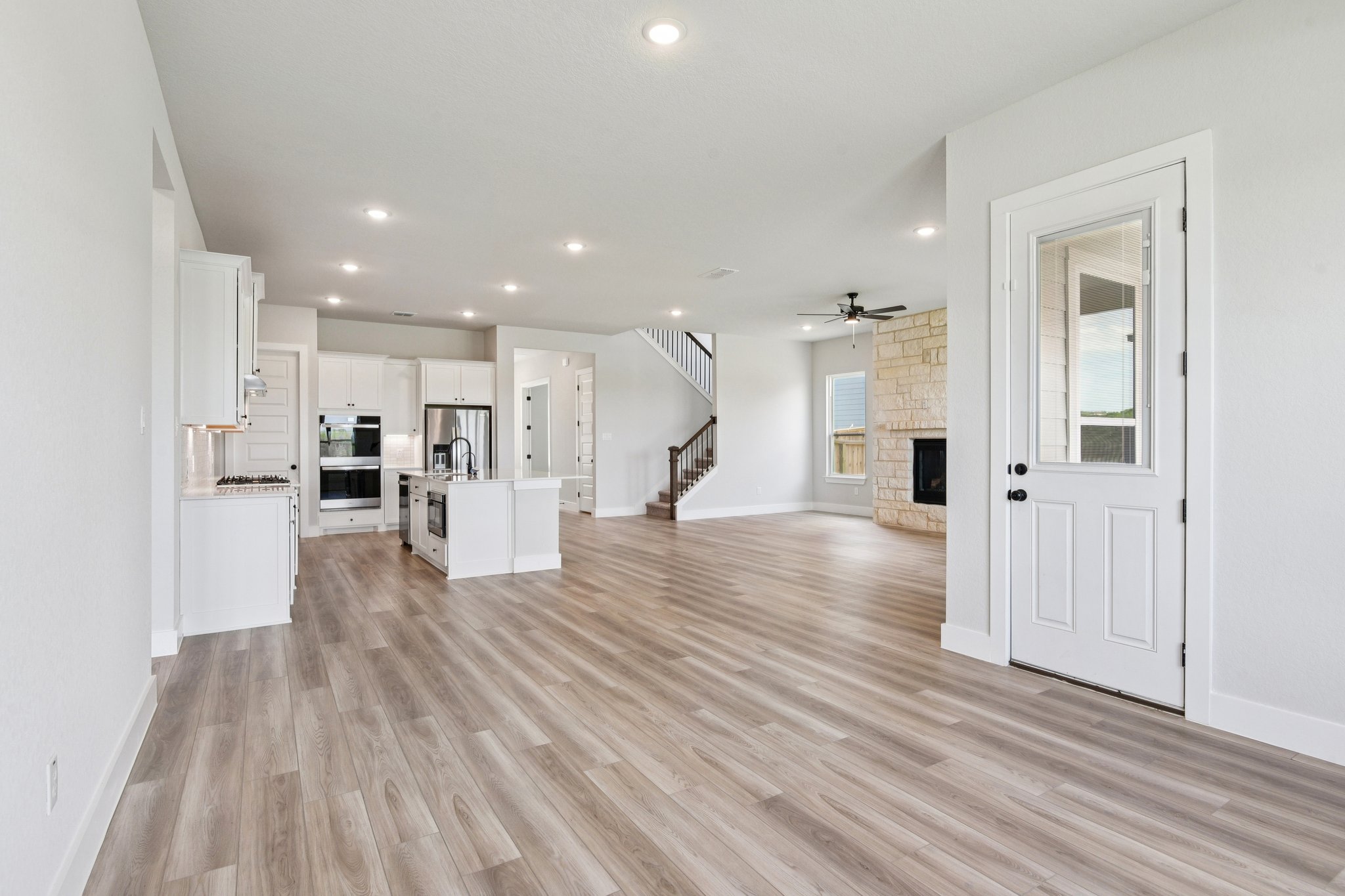 A large kitchen with white cabinets.