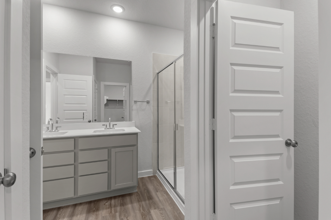 A bathroom with a glass shower.