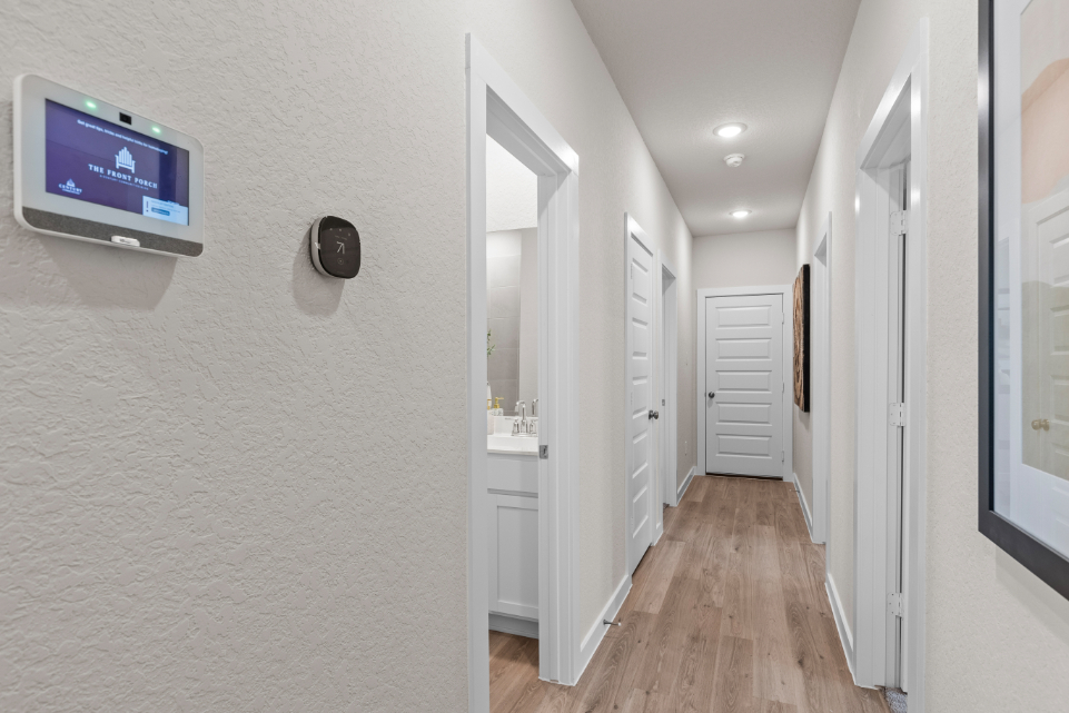 A hallway with white walls.