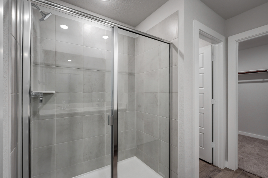 A shower with glass doors.